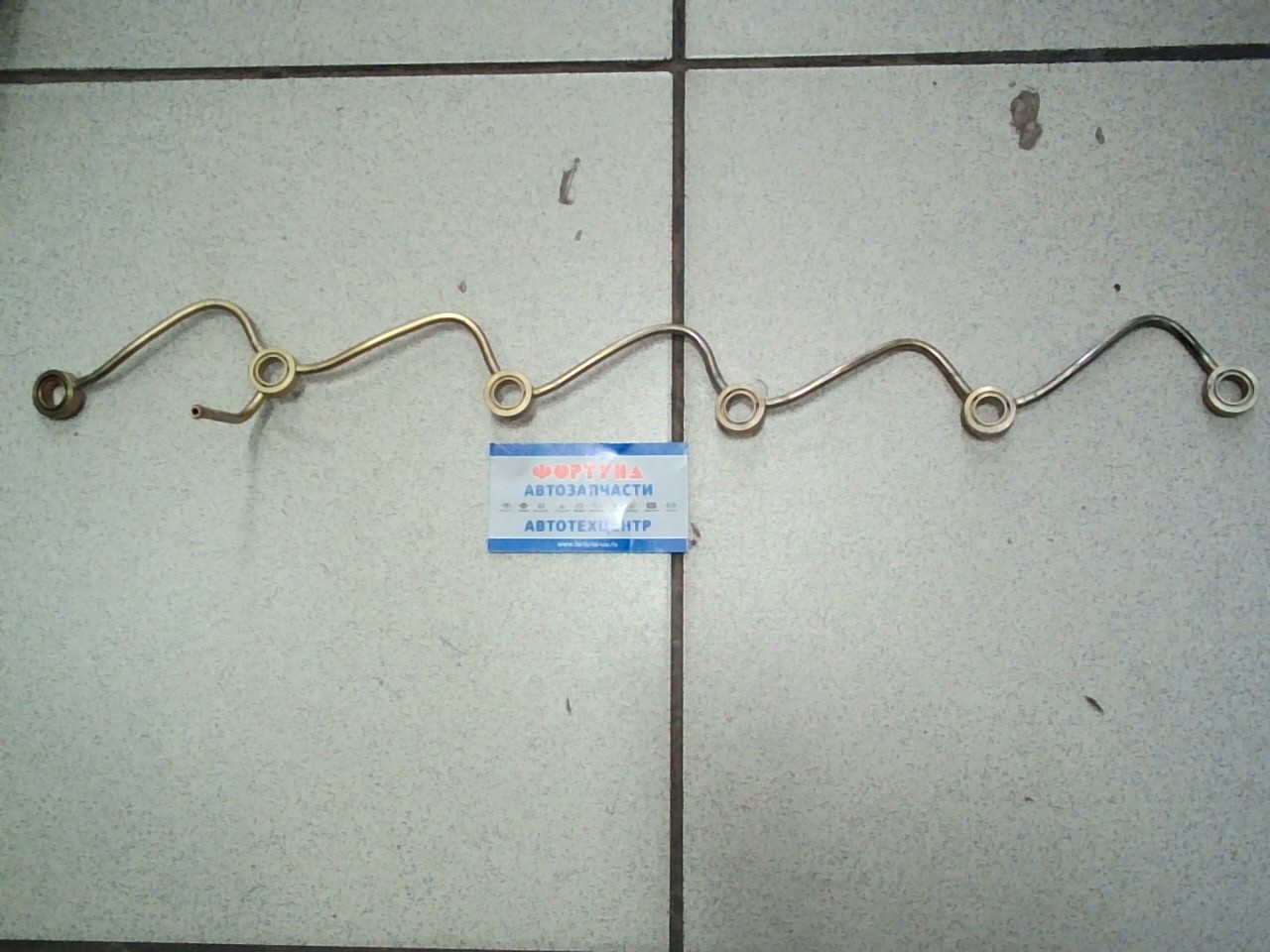 Трубка обратки MYG-012 [16670-06J00/16670-06J0B] /TD42/ NISSAN(TW)