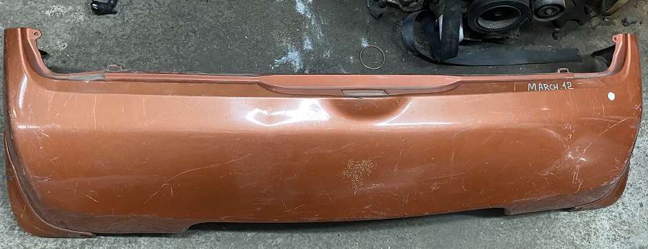 Бампер задний NIS MARCH K12 /оранж. с брызговиками/ [б/у]