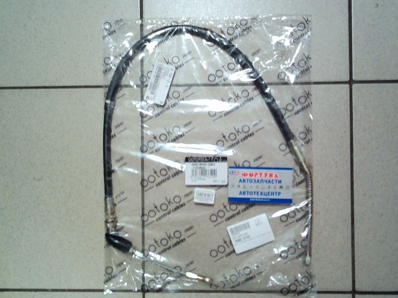 Трос ручного тормоза MAZDA 1709B03 OOtOkO /TITAN WGEAD,  WEFAD,  WGFAD,  WELAN,  WGEAH,  WGFAT 930mm/