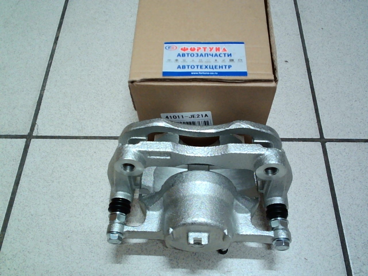Суппорт тормозной 41011-JE21A TW передний левый /X-Trail T31,  Qashqai J10/