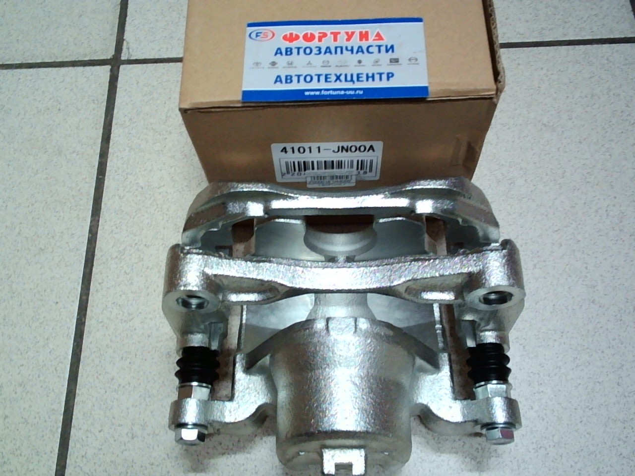 Суппорт тормозной 41011-JN00A TW передний левый /Teana J32,  Sylphy B17,  Juke F15/