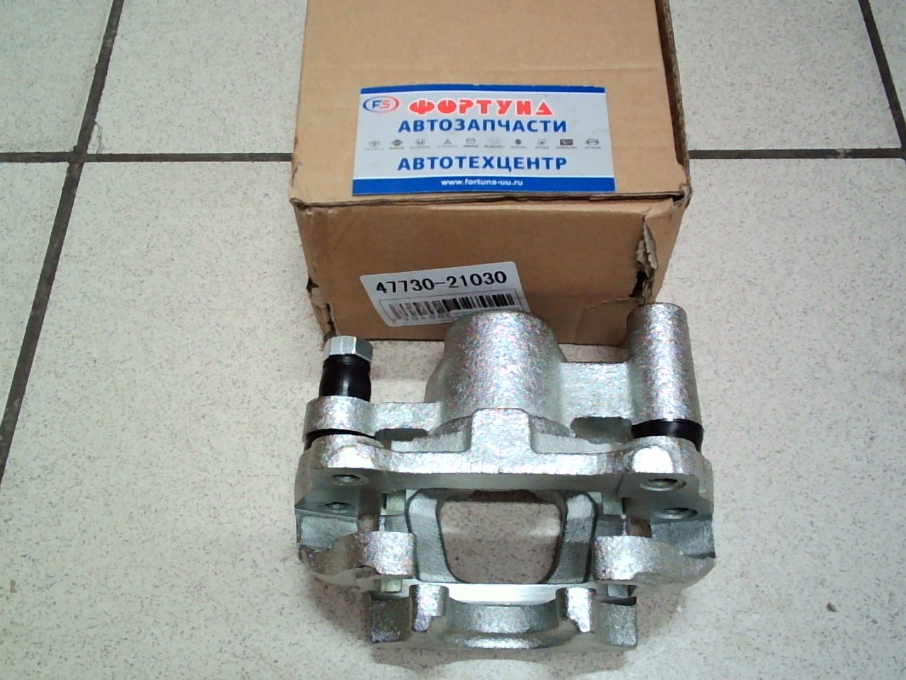 Суппорт тормозной 47730-21030 TW задний правый /COROLLA, SPACIO NZE12#, ZZE12#/